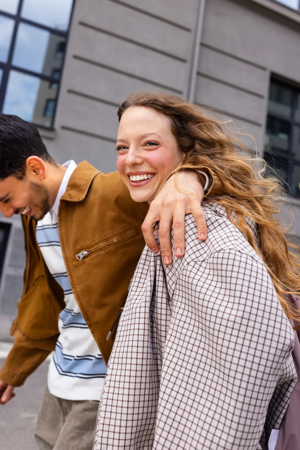 A cheerful couple walking together outdoors